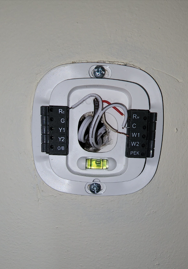 Smart thermostat installation with precise temperature control and energy monitoring capabilities